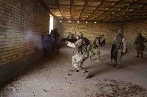 Falluja: Marine fires a grenade at insurgent positions